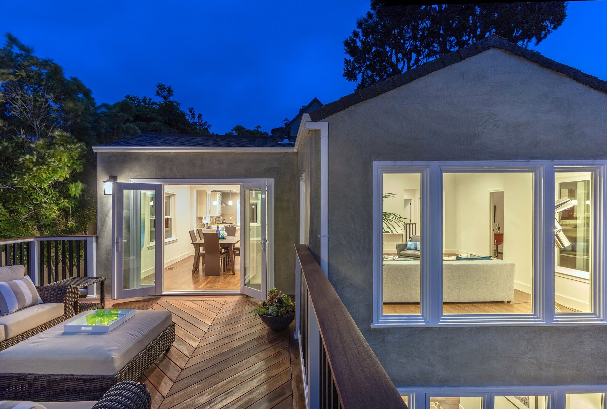 Home,With,Furniture,Patio,/,Wooden,Deck,At,Twilight.