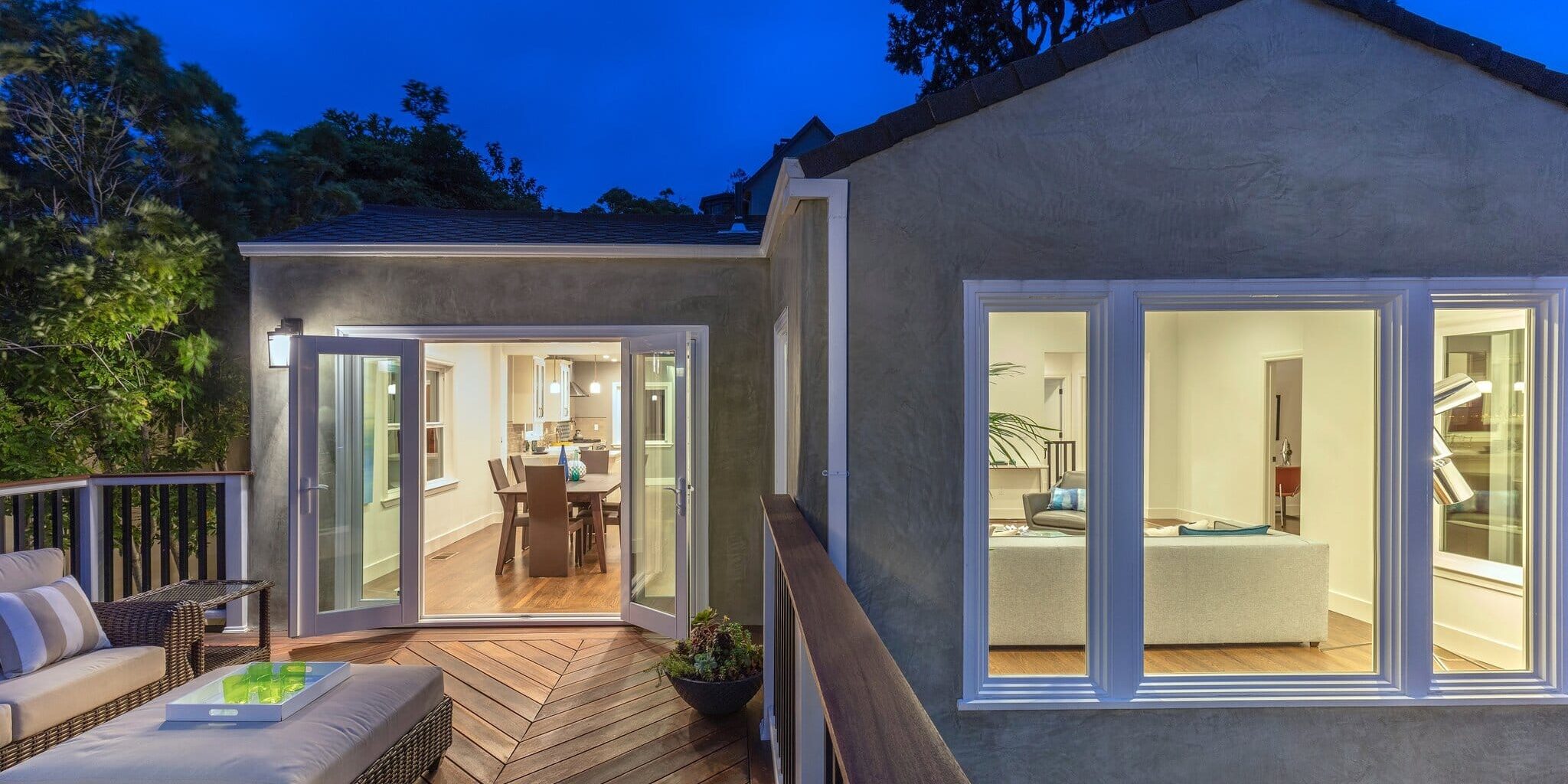 Home,With,Furniture,Patio,/,Wooden,Deck,At,Twilight.